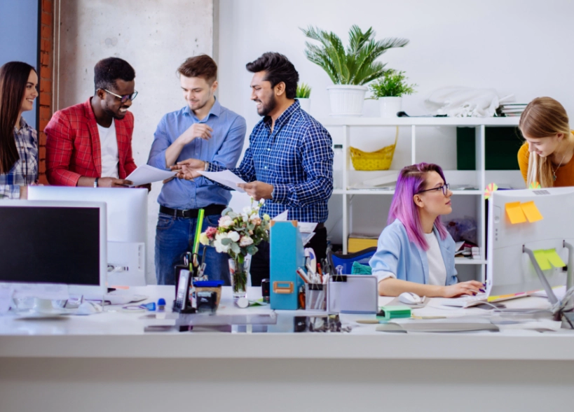 A marketing team discussing client success